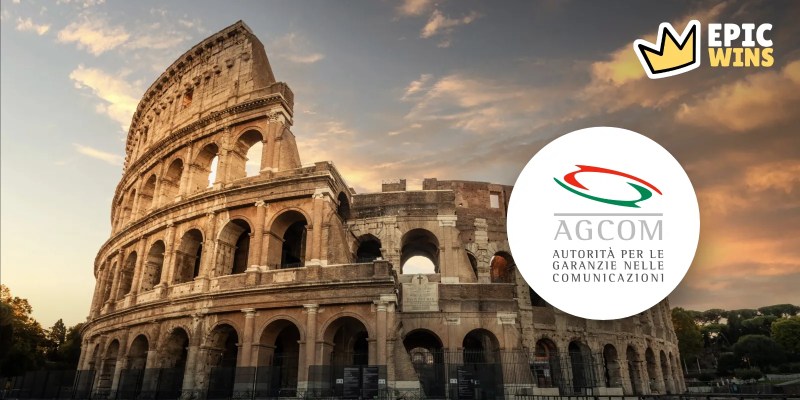 The Colosseum in Rome at sunset with the AGCOM logo in a white circle