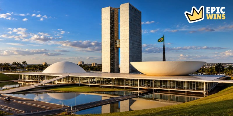 National Congress building in BrasÃlia with its twin towers, dome and bowl, and the Brazilian flag