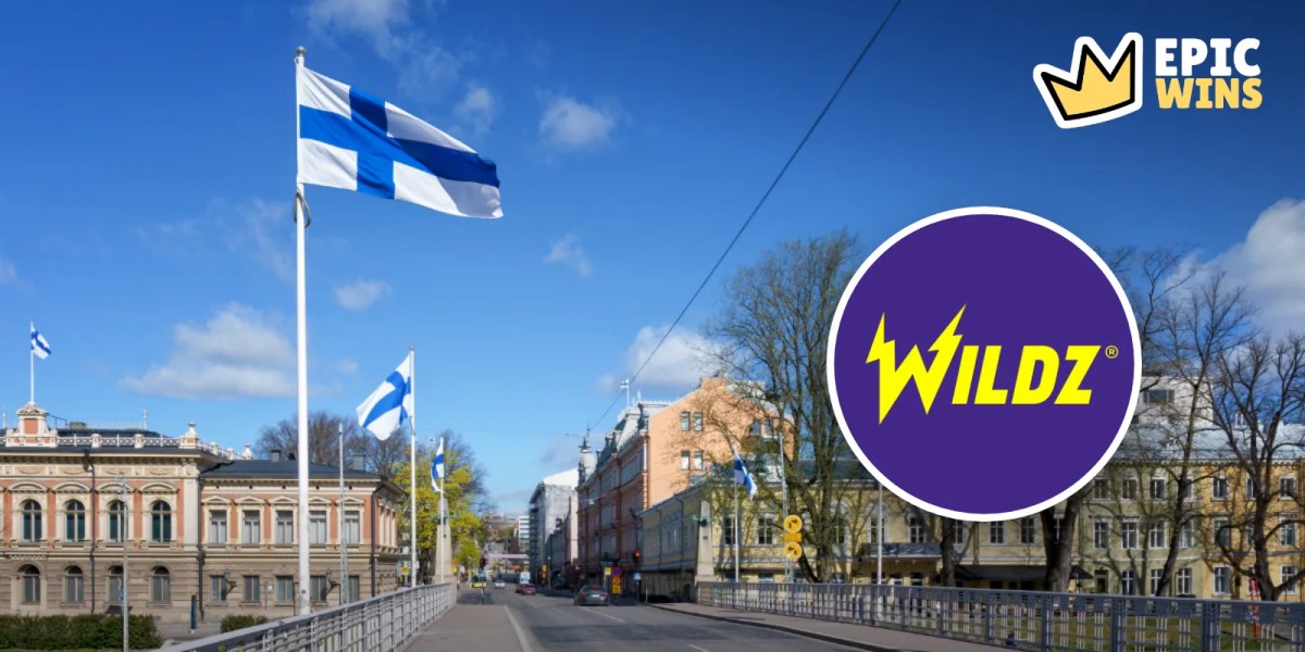 Finnish flags over a Helsinki street with a Wildz logo badge and the EpicWins logo
